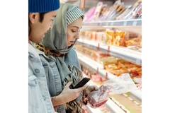Image People buying meat in store.